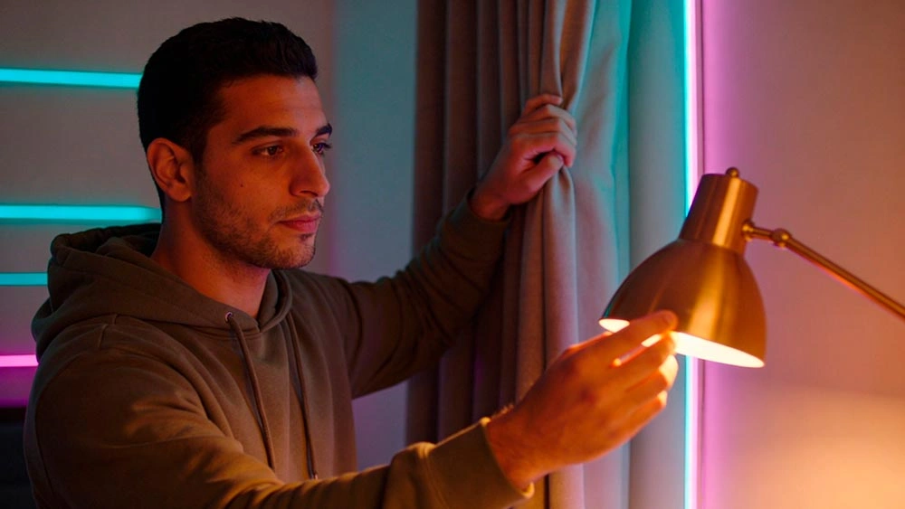 omegle alternative safety: privacy first setup omegle alternative safety: man closes curtains and turns on a warm lamp to protect privacy before a 1-on-1 video chat
